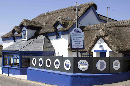 This is a picture-postcard fishing village with a row of whitewashed
thatched cottages. You can arrange for an angling trip (contact Dick Hayes
of Enterprise at % 053-912-9704); visit Kehoe’s Pub (% 053-912-9830),