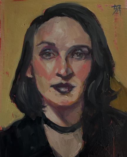 A femme-presenting non-binary person with dark hair, shimmering purple & blue glam goth makeup wearing black with a black ribbon choker. An ochre background behind. 