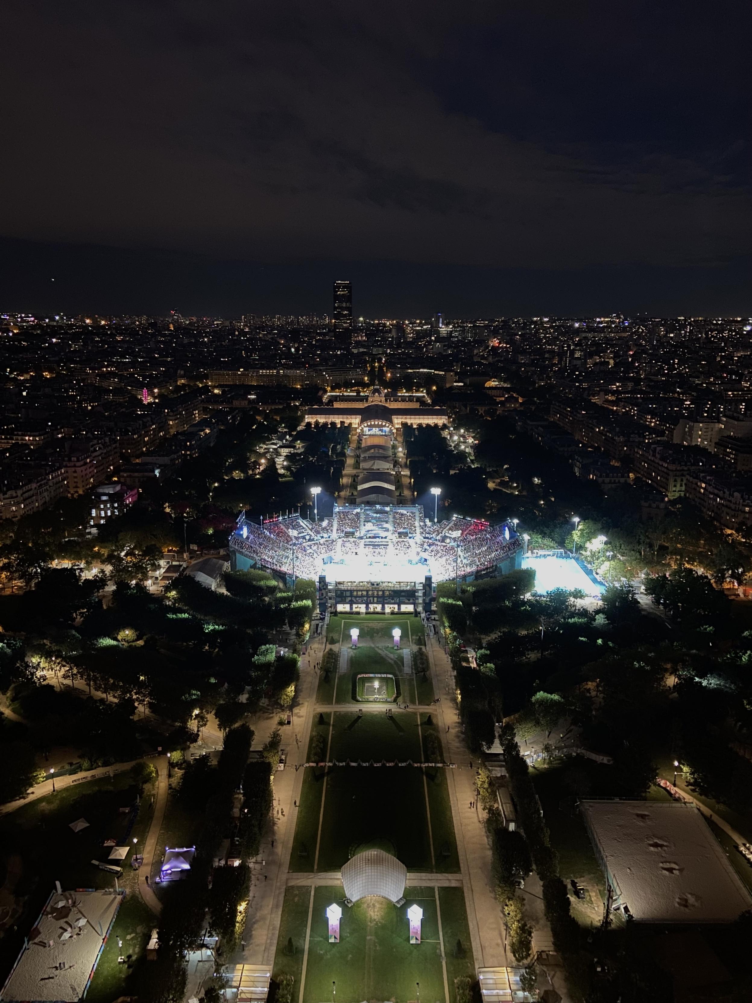 A stadium of the Olympic Games at night as seen from platform two of the Eiffel Tower