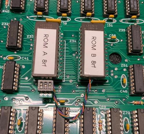 Replacement ROMs for TRS-80 Model 1 which provide multiple selectable ROM images,