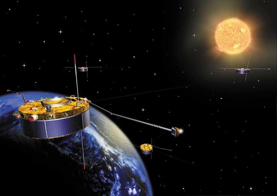 An artist impression of the four Cluster II satellites orbiting Earth with the Sun in the distance.