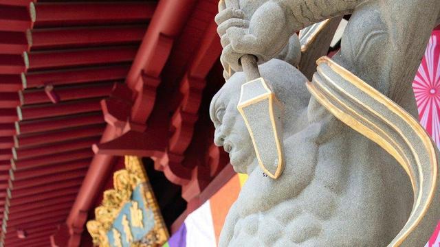 Guardian deity outside temple.