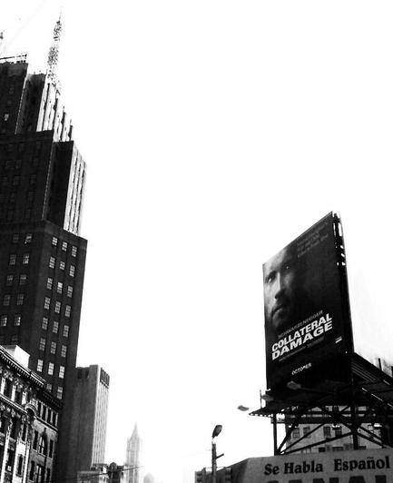 attacks it was postponed until Feb 8 2002.

Two days before this picture was taken  the 2 WTC Towers would've been visible behind and to the left of the billboard w/ Schwarzeneggar's face

The sky is overcast with smoke from the WTC buildings drifting north over Manhattan on 9/12