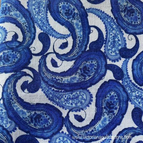 Blue paisleys on white background. 