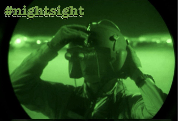 What looks like a soldier with a helmet on, viewed through a night sight