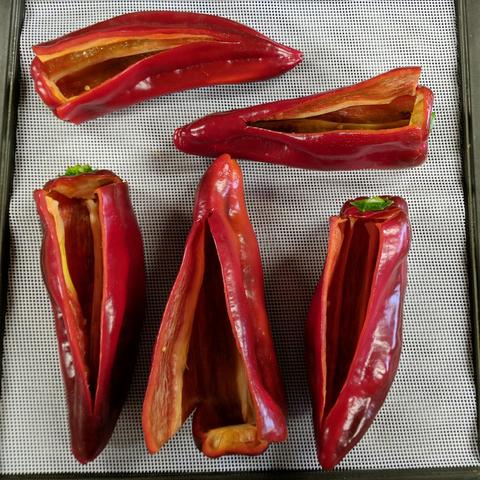 5 of the largest peppers that have been split on one side most of the way down and the across at the base of the top to peel open and remove the seeds.