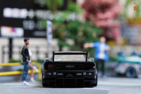 A rear side of LB-Super Silhouette, Nissan Silvia S15 by Time Micro in 1:64 scale with 1:64 figures on AREA 164
