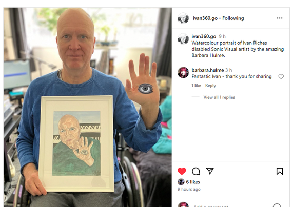 2nd image - Ivan holding his framed portrait.