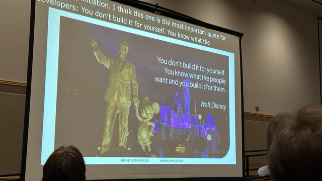 A photo of a Walt Disney statue and the caption that says we should build for the people.
