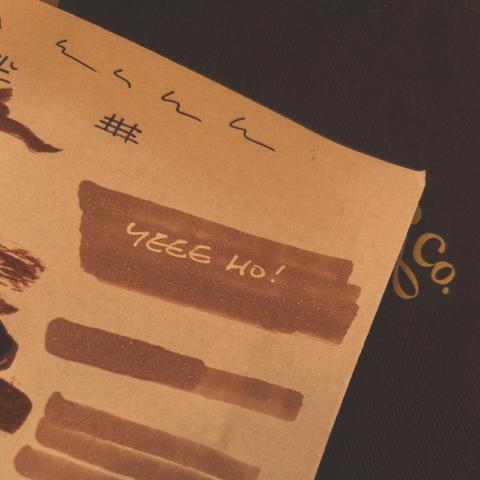 Rough sketch with white text on light brown background 