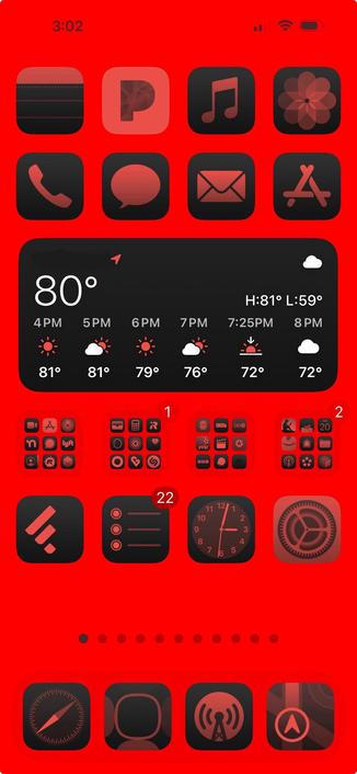Red iPhone home screen with grayish-pink and black icons and weather widget.