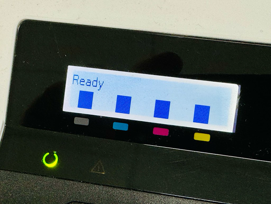 Close up of a color laser printer’s LCD indicator of toner ink levels.