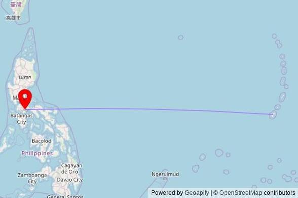 A map showing the great circle route from Tamuning in the United States to a map pin at Padre Pio Chapel, Maharlika Highway, Tiaong, 4325 Quezon, Philippines