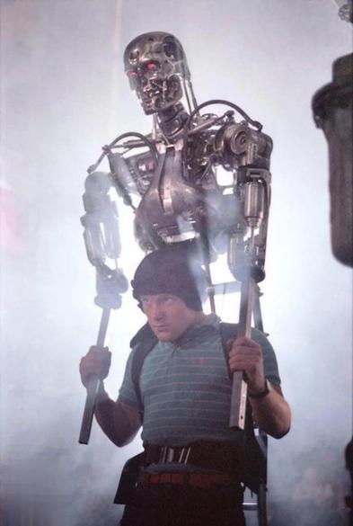 Shane Mahan of Stan Winston Studios with the upper torso of the Terminator model on his head during the filming of the movie.