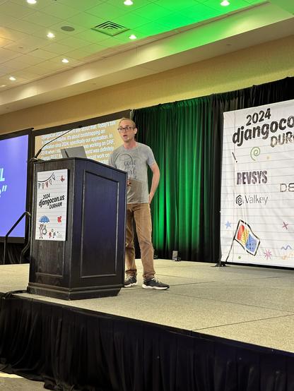 Carlton Gibson on stage at DjangoCon US.