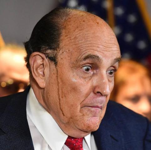 Rudy Giuliani Surprised with spray can hair running down his face 

That’s gotta be what that streak is right?