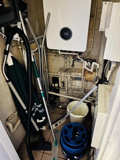 A small boiler room no more than 1.5 by 1m in size almost full with cleaning equipment, the boiler and a myriad of pipes. There is no room to sleep.