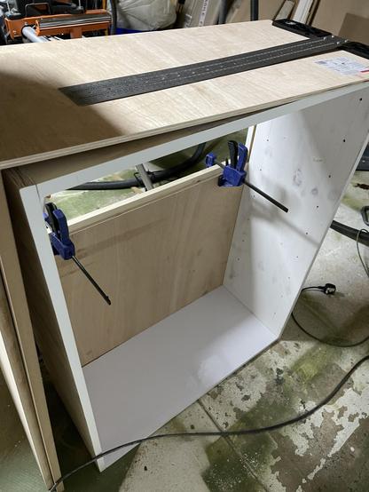 One part of the back slid into the dado! A horizontal joiner incorrectly glued to the back! That was supposed to be cut at 45degree angle to act as one part of french cleat! 