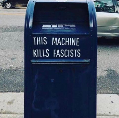 Street post box with sticker 
THIS MACHINE KILLS FASCISTS
