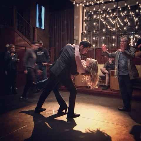 Behind the scenes picture of Tom Ellis & Lauren German as Lucifer & Chloe, dancing.