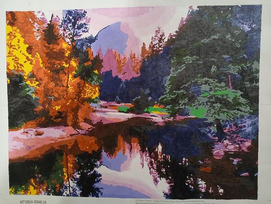 A paint by number of an autumn scene by a lake.