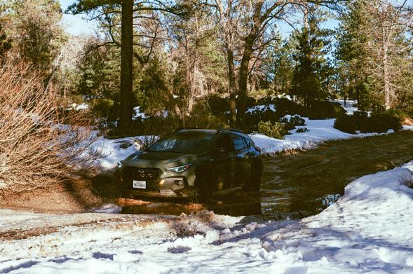 A car driving through a mud puddle