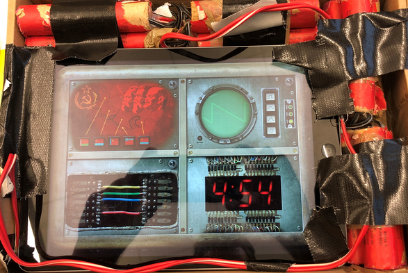 The mobile game "Escape the BOOM!" on an iPad, embedded in dynamite props.