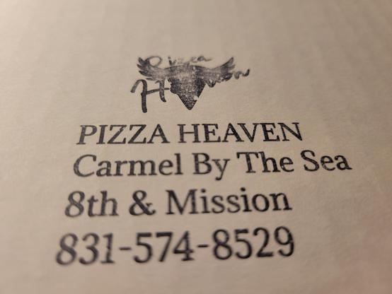 Pizza box ink stamp showing the Pizza Heaven logo (a vertical slice of pizza with angel wings, under the script text Pizza Heaven), followed by 

PIZZA HEAVEN  Carmel By The Sea  8th & Mission  831-574-8529  
