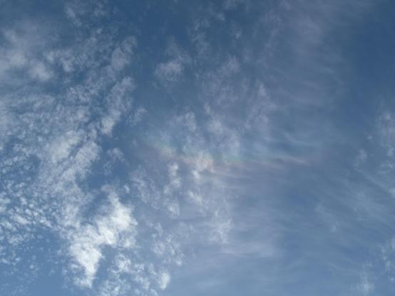 A wider view of the same scene, showing the arc fades out after short distance, only covering a small fraction of the circle, and that the sun is out of scene below