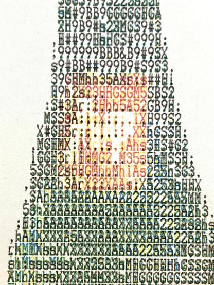 Detail from an ASCII art from a dot matrix ImageWriter II in color of a pink flower in a green bottle. The detail show the bottle closeup is made from ASCII text with the four CMYK colors overlapped. 