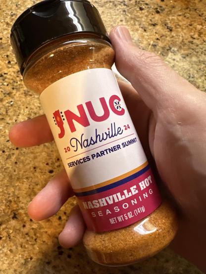 A jar of Nashville Hot Seasoning branded for our JNUC Services Partner Summit.