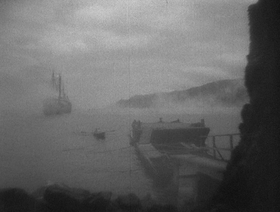 an image of a dock and a ship in the water, very foggy out