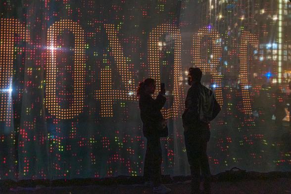 a couple in front of Distance to Mars, 2024
