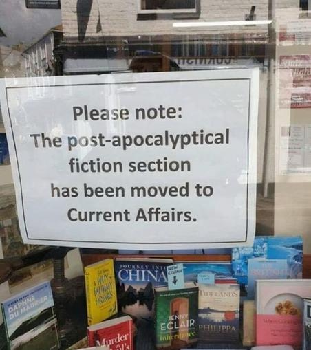 a sign in a book shop window 
