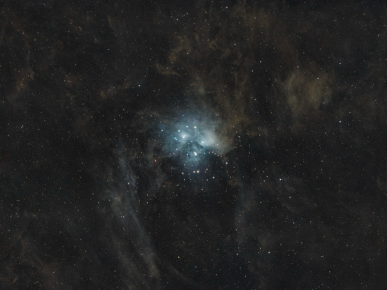 Interstellar dust with a blue star cluster in the middle