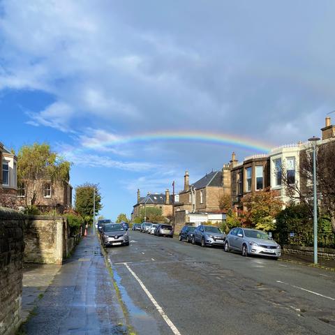 Bright rainbow, a bit of blue sky, very faint double 