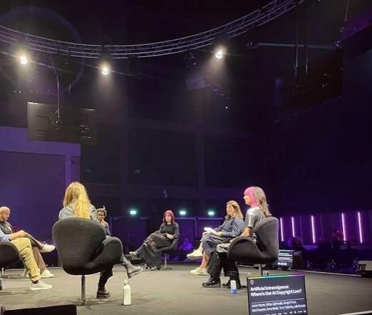 Kat Five on stage in the AI Summit panel at Beyond The Music conference and festival at Factory International, Aviva Studios, Manchester