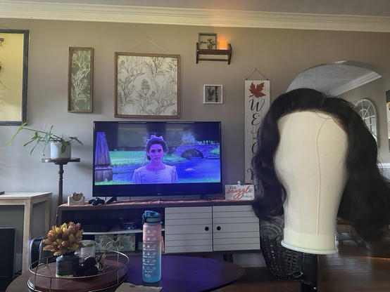 Un-styled wig with the move the labyrinth in the background 