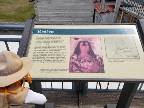 Ranger Sarah reads about the Bastions at Fort Union Trading Post.