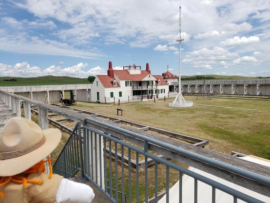 Looking down at the court yard Range Sarah can see he 63-foot flag pole at the center of the post proudly flies a ca. 1851 thirty-star flag and the Bourgeois House.
