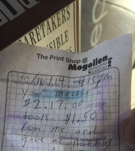 A sheet of paper saying “10/16/14 4:15 pm your machine #2.17.00 took $1.50 from me and gave me nothing”