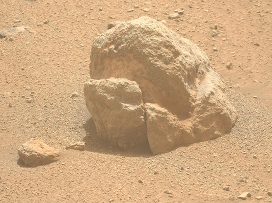 Crop of the linked Perserverance image, sol 1301, of a float rock on the Jezero crater rim