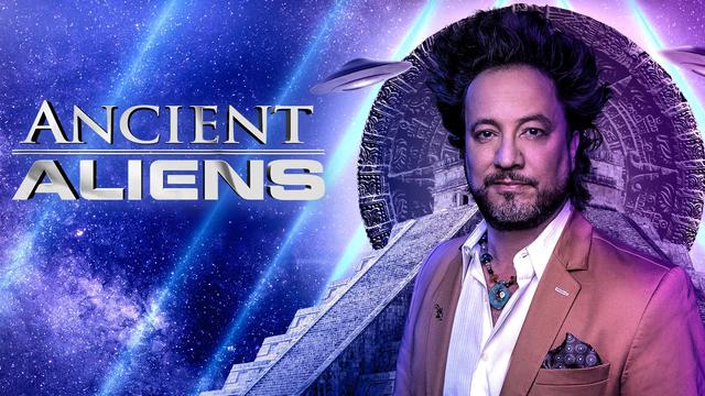 Giorgio A Tsoukalos in a fine satin suit