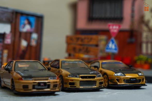 Nissan Skyline GT-R VR32 Top Secret by Facal Horizon, Nissan Skyline GT-R (R34) Top Secret Gold by MINI GT and Toyota Supra (JZA80), Top Secret Gold by Time Micro in 1:64 scale on AREA 164