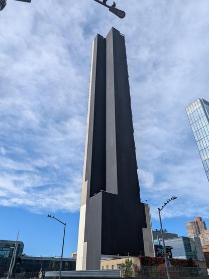 The building is clad in a black covering, making it look like it has a lo-fi texture map.