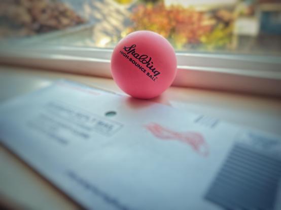 A ballot envelope on a windowsill with a pink Spalding rubber ball, which is a West Wing reference to the character of Toby Ziegler played by the incomparable Richard Schiff.