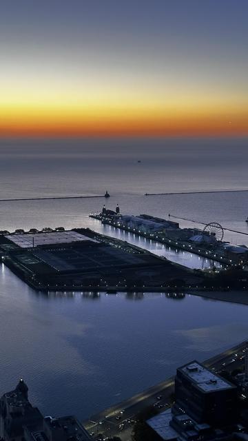 Warning signs of oil slick on the unusually calm waters of #LakeMichigan at #NavyPier in #Chicago this morning.

There are no clouds in the sky. What you are seeing on the water is oil from personal and cruise boats.