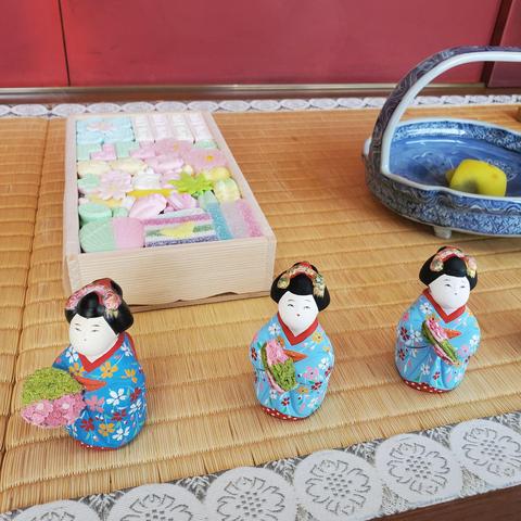 Tiny maiko dolls advertise sweets during the spring dances.