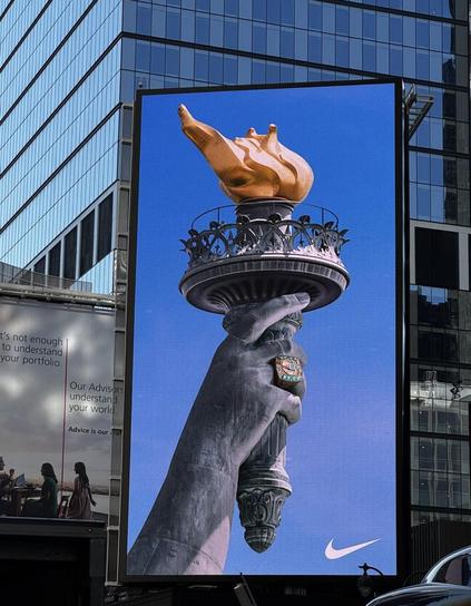 Nike billboard ad in NYC of the Statue of Liberty’s hand and torch. There’s a NY Liberty championship ring on one of the fingers.