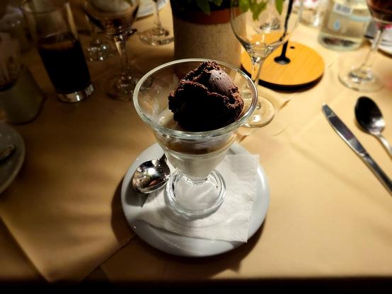 Glass bowl with ice cream, vanilla and chocolate